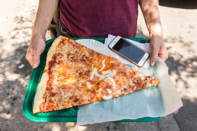 THE BIGGEST SLICE OF PIZZA (2848 and 4087 Broadway)Koronet is not the best pizza in NYC. It is probably not the 10th best or 30th best, either. "It is only OK," said one native Manhattanite when interviewed for this story. Another offered this:Koronet is a life-saver when you're that special kind of drunk where one slice of pizza isn't enough, but a stromboli is too much and too messy. While it might not be the best pizza in the neighborhood (that'd be V&T by a country mile), it's a good bargain for its size and the single best place in Morningside Heights for late-night people watching.Indeed, its superlative is squarely in its size: a full Koronet pizza is the size of a backyard trampoline, and a slice of it is the size of a pennant flag. Does anyone need to ingest that much pizza? Ask me again when I've just spent the night drinking beer. And you can always share it with a new friend, 'Lady and the Tramp' style.   (Photo by Tod Seelie/Gothamist)
